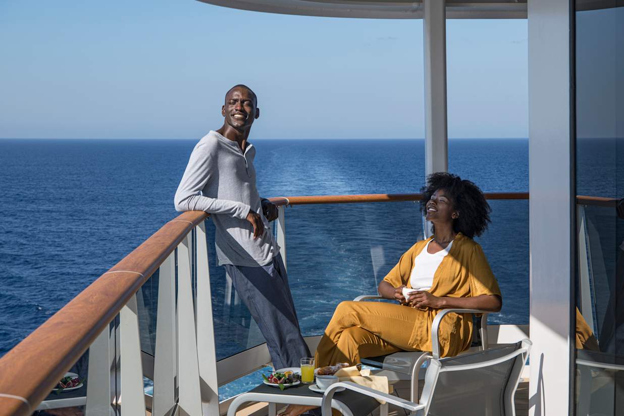 A couple on a balcony onboard an MSC Cruise ship