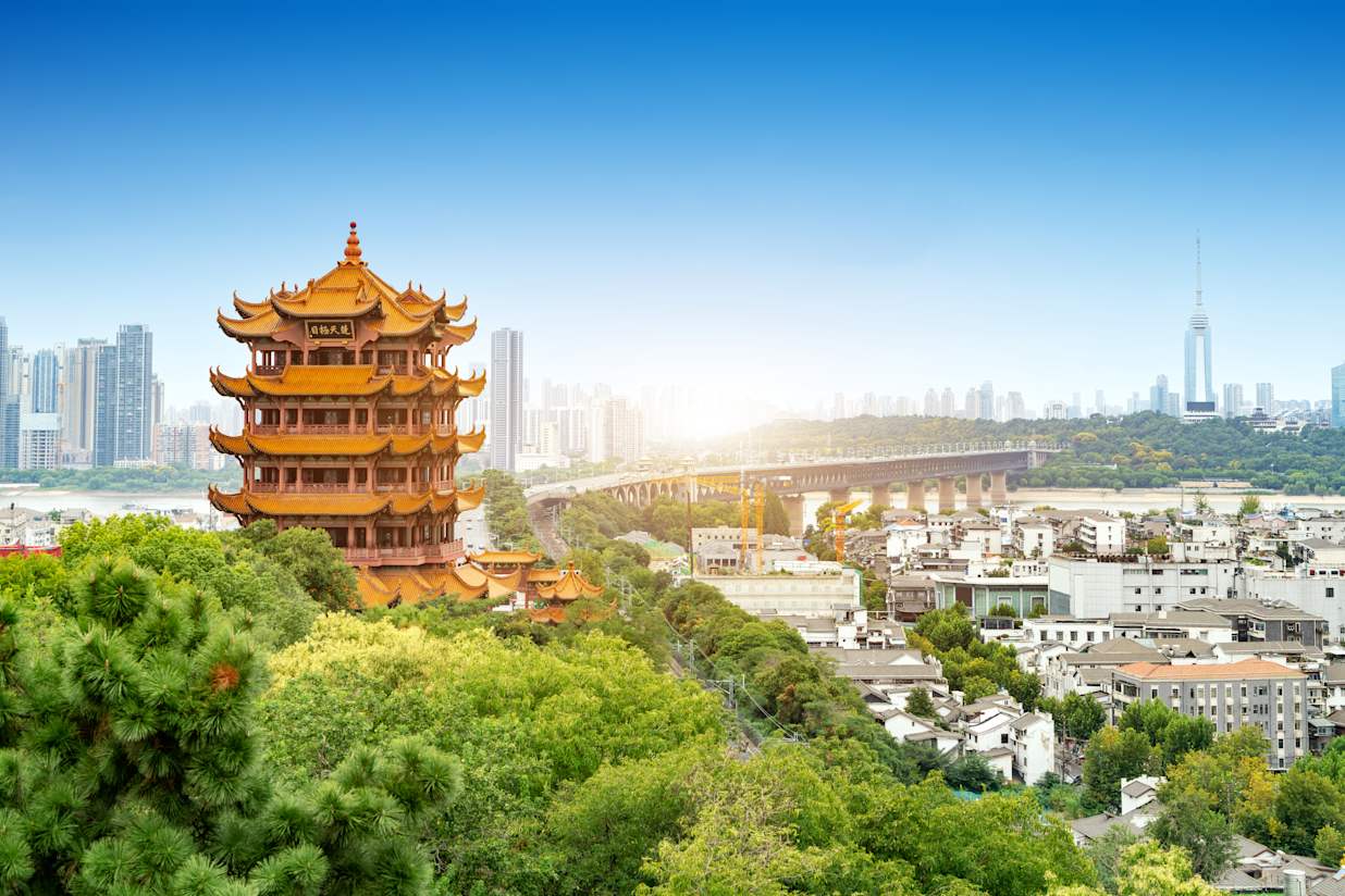 Yellow crane tower against blue sky in wuhan, China, the four Chinese characters mean As far as you can see in Hubei.