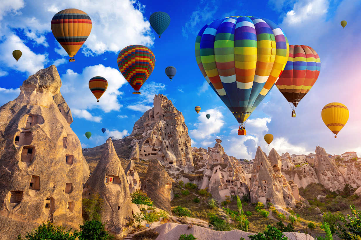 hot air balloon flying over Cappadocia, Turkey.
