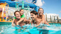 Family in a pool onboard Norwegian Encore
