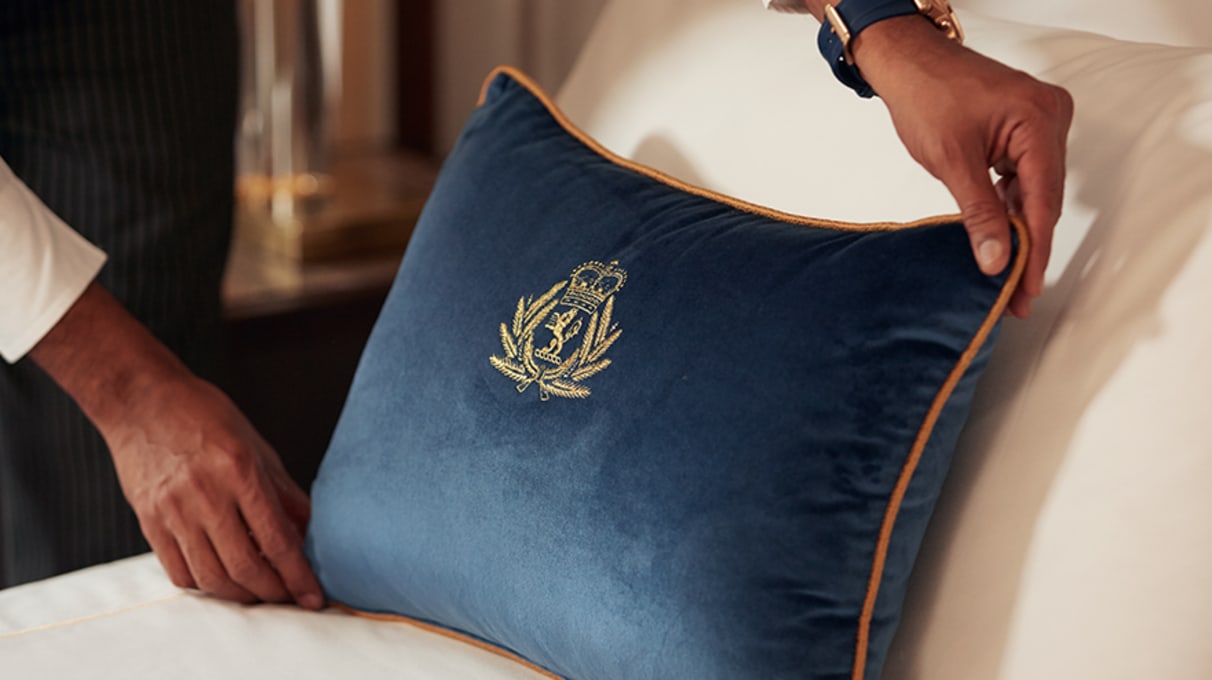 Cunard cushion on bed